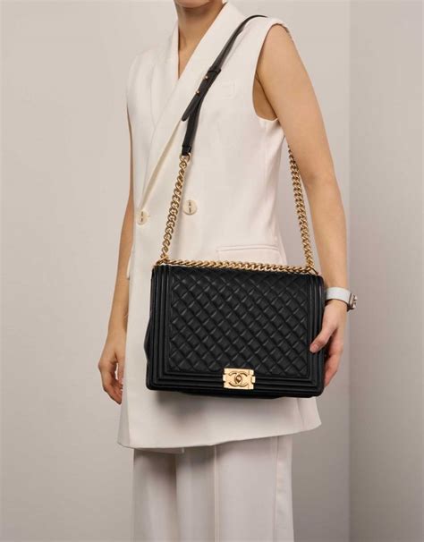 carrying boy chanel handbag|Chanel black boyfriend bag.